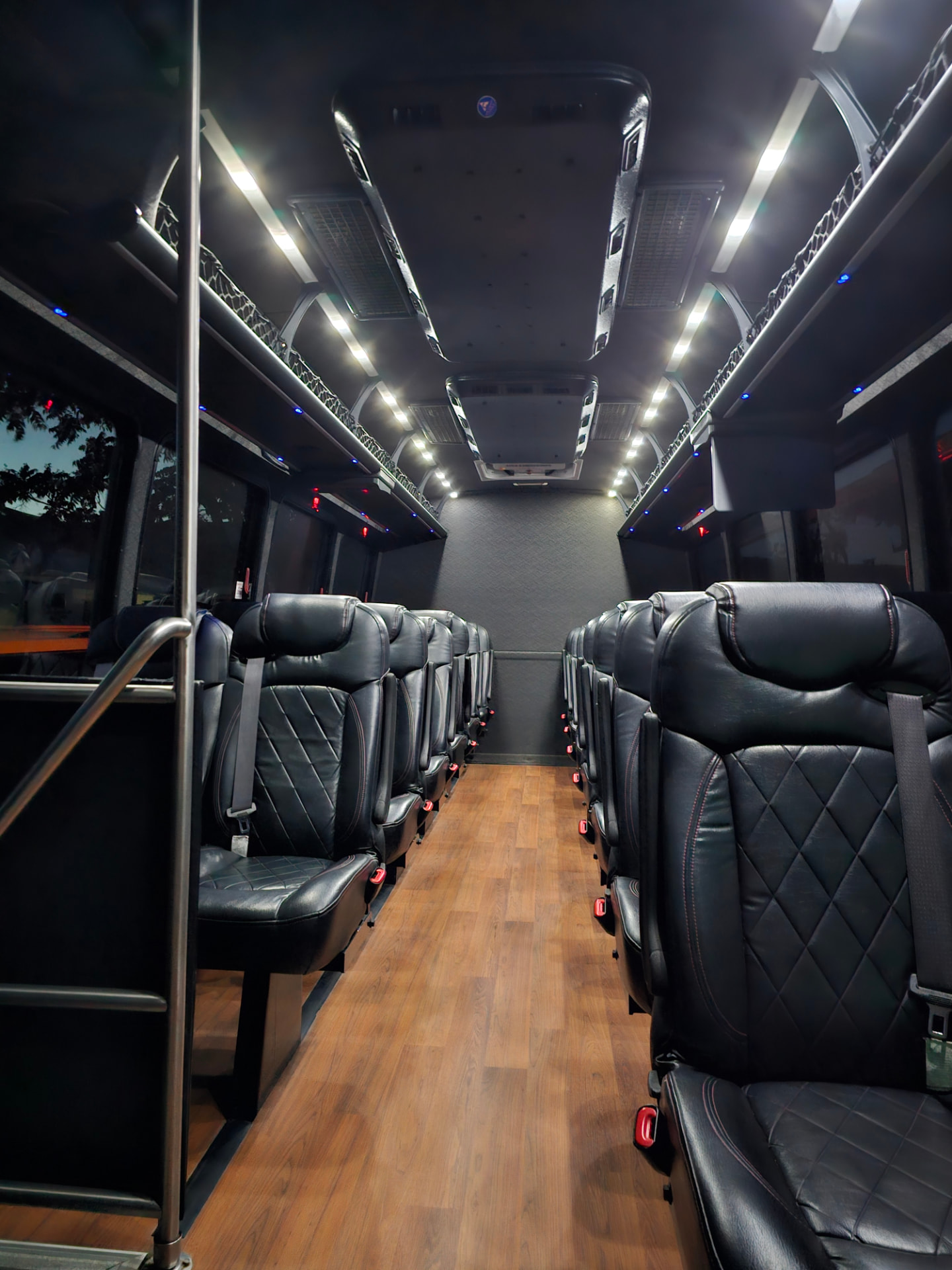 Executive shuttle interior with black leather seats for Tri-Valley corporate and group transportation