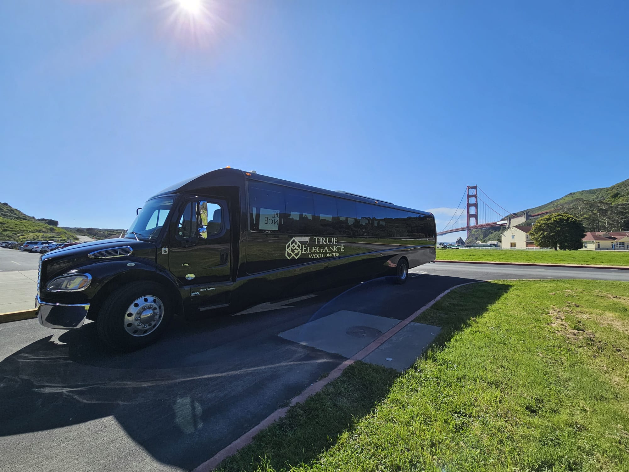 Charter bus at the Golden Gate Bridge Black True Elegance charter bus on a Bay Area group trip near the Golden Gate Bridge