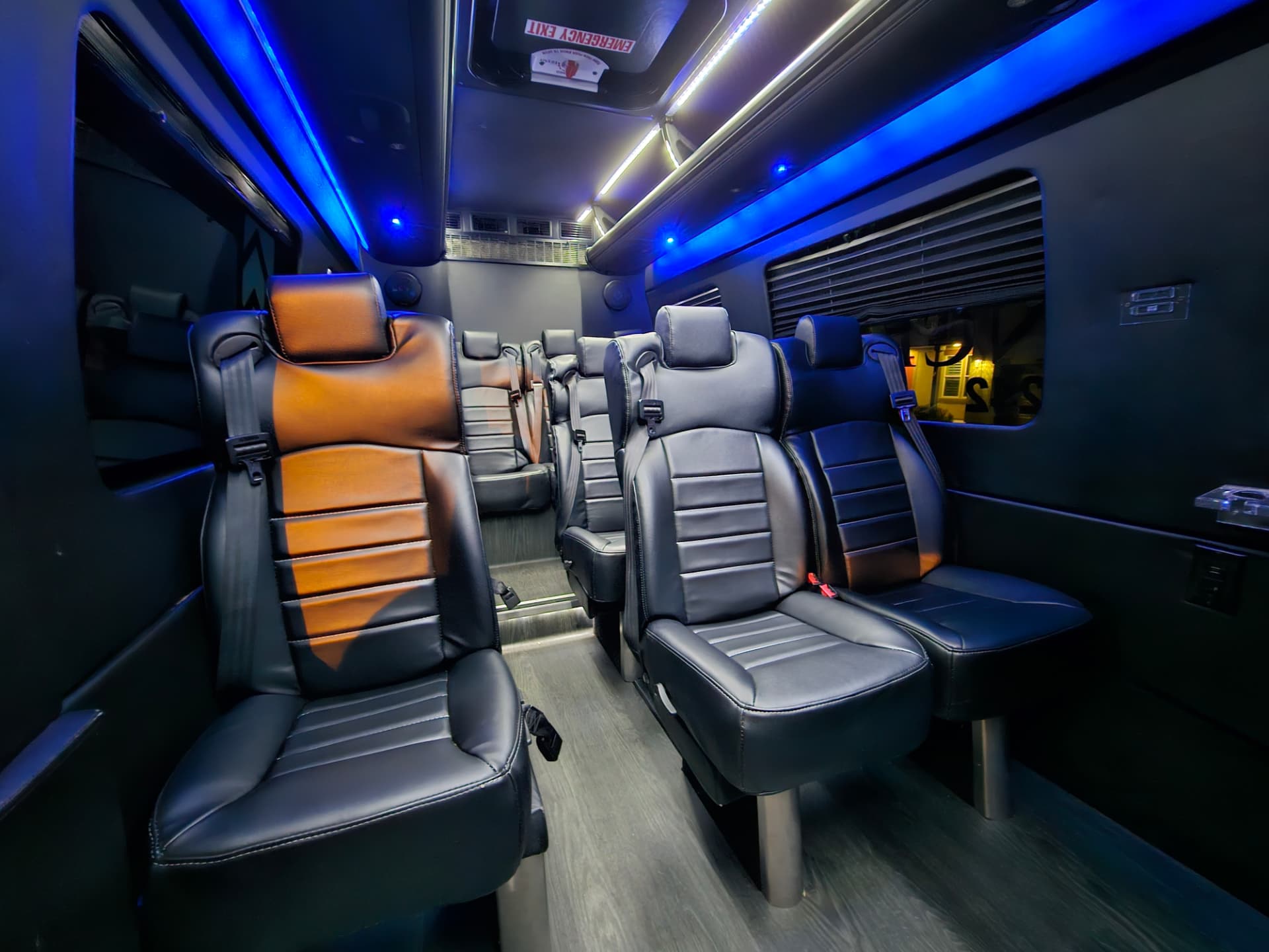 Sprinter van interior Interior of a True Elegance Sprinter van with black leather captain seats and blue LED accent lighting