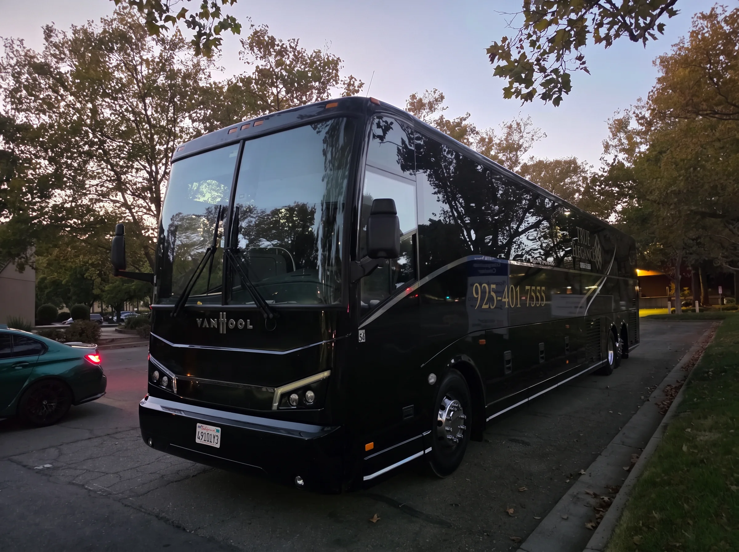 Event motorcoach at dusk Black True Elegance motorcoach staged at dusk for Bay Area event transportation