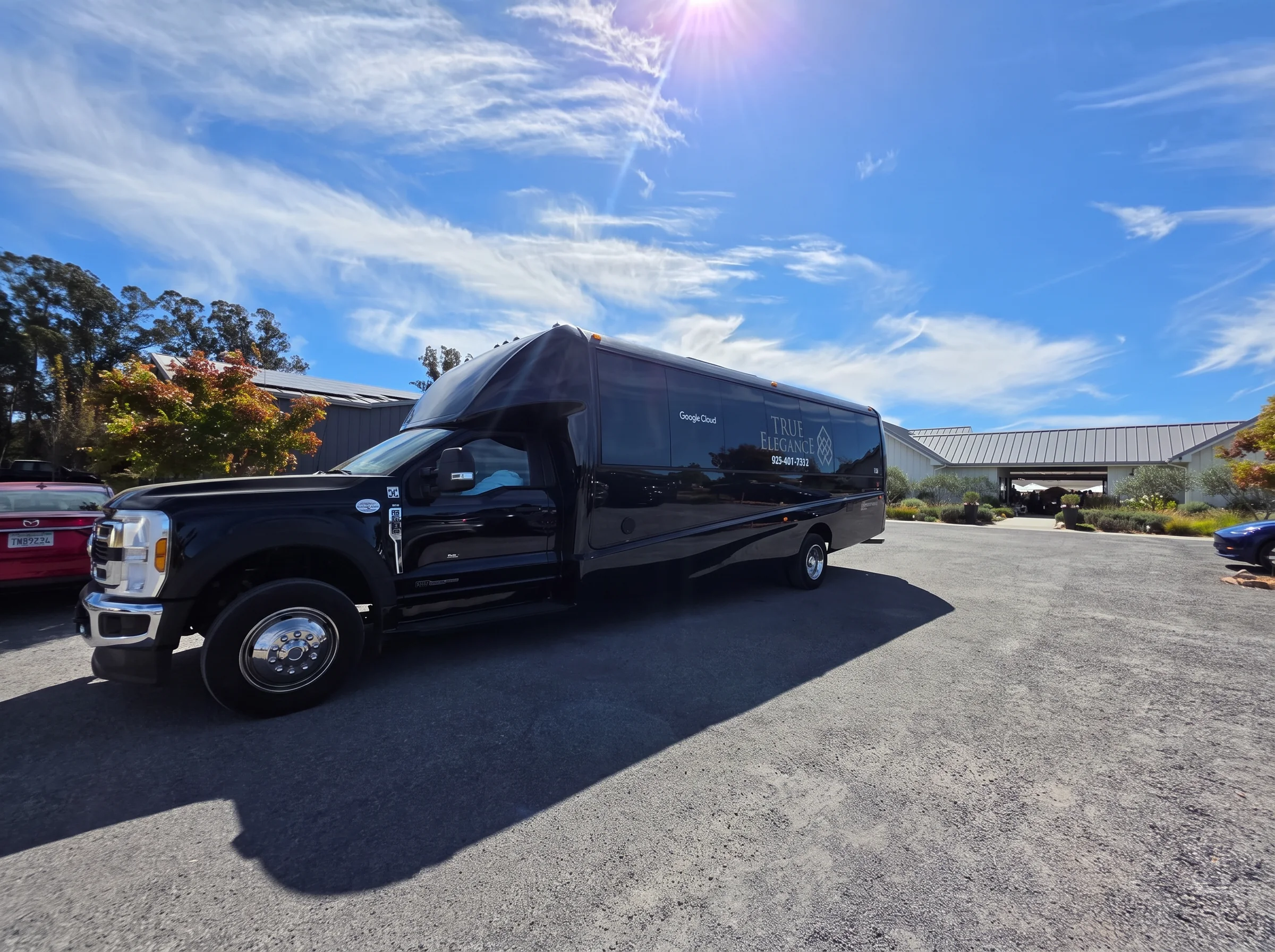 Livermore Valley winery shuttle Black True Elegance shuttle bus parked at a Livermore Valley winery for a private wine tour